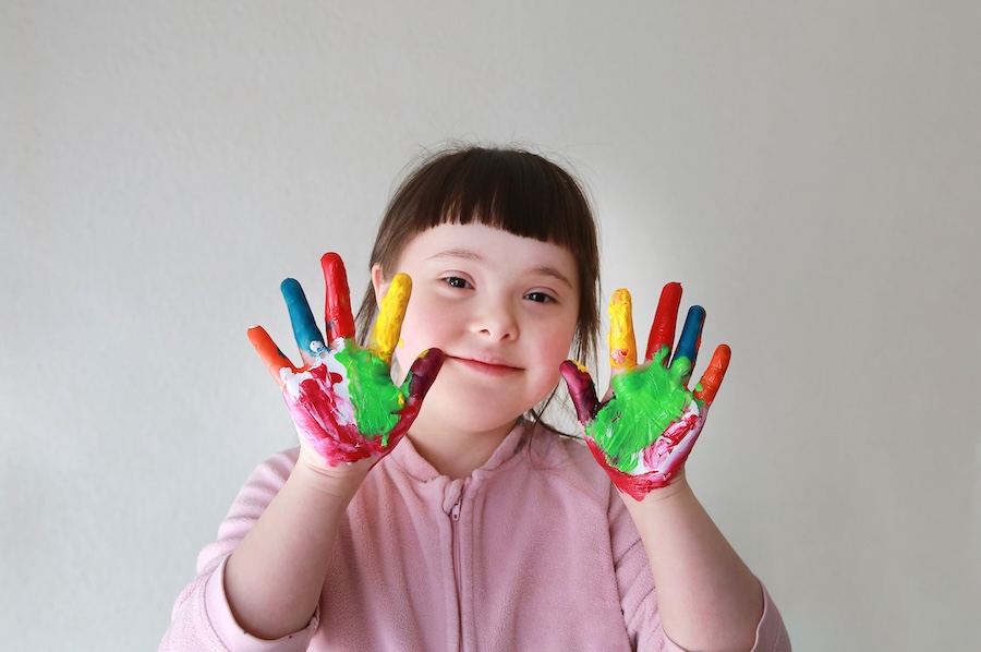 Cute little girl with painted hands