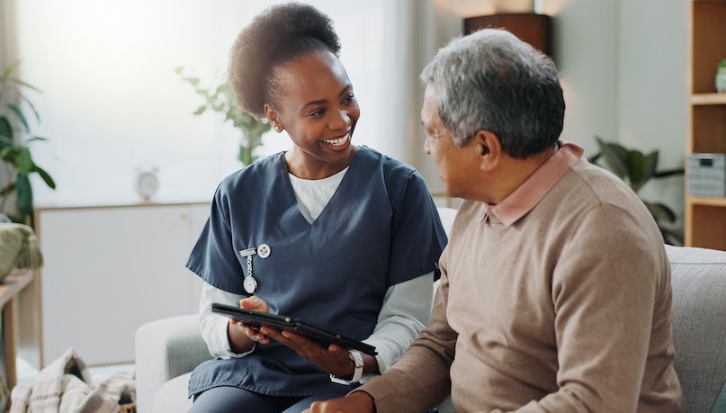 Tablet, healthcare and african nurse in home with senior man