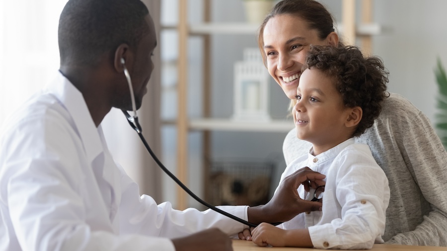 African male pediatrician hold stethoscope exam