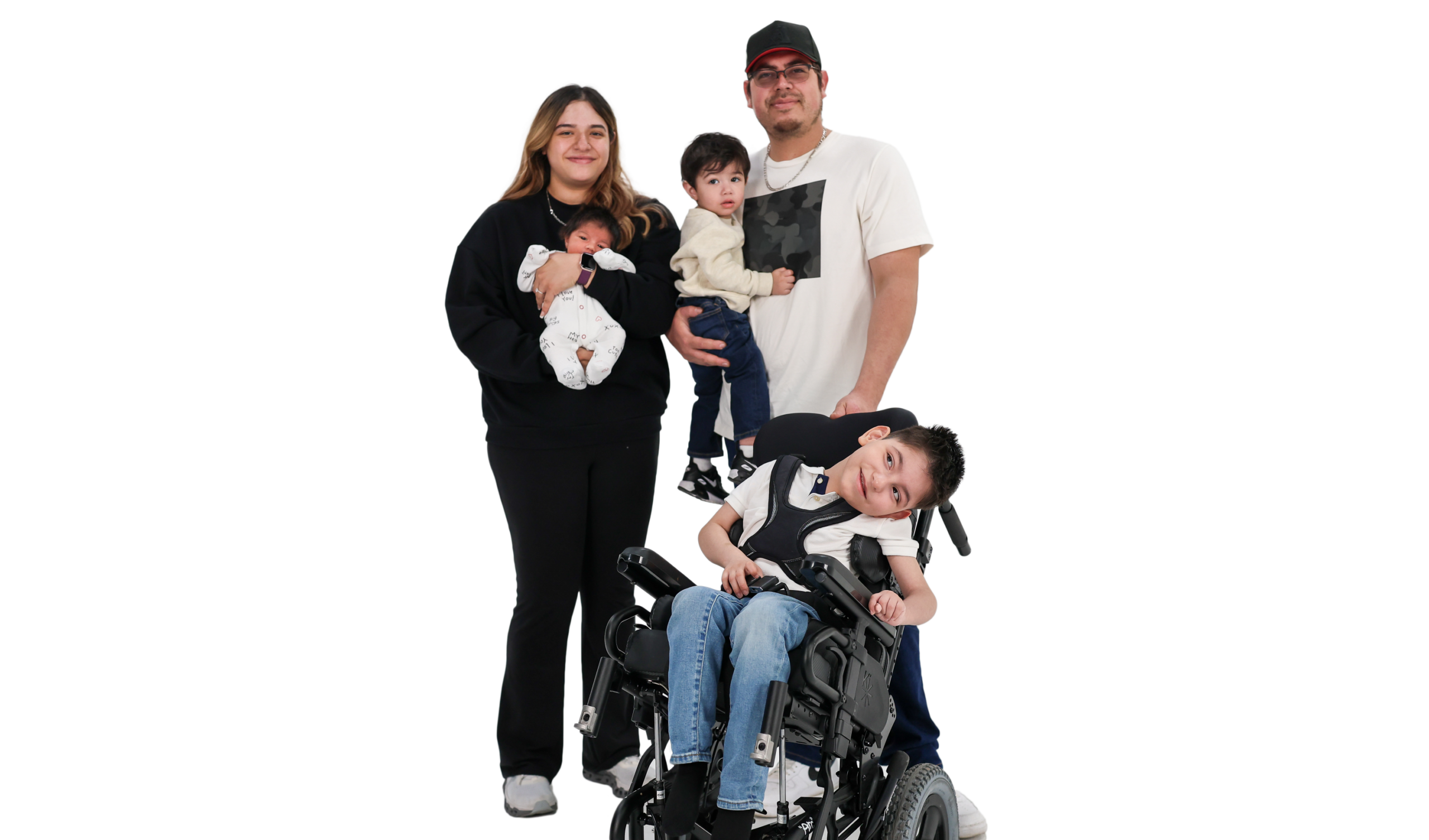 Team Select In The News Family Family of five posing together: mother holding a newborn, father with a young child, and an older child in a wheelchair in front.