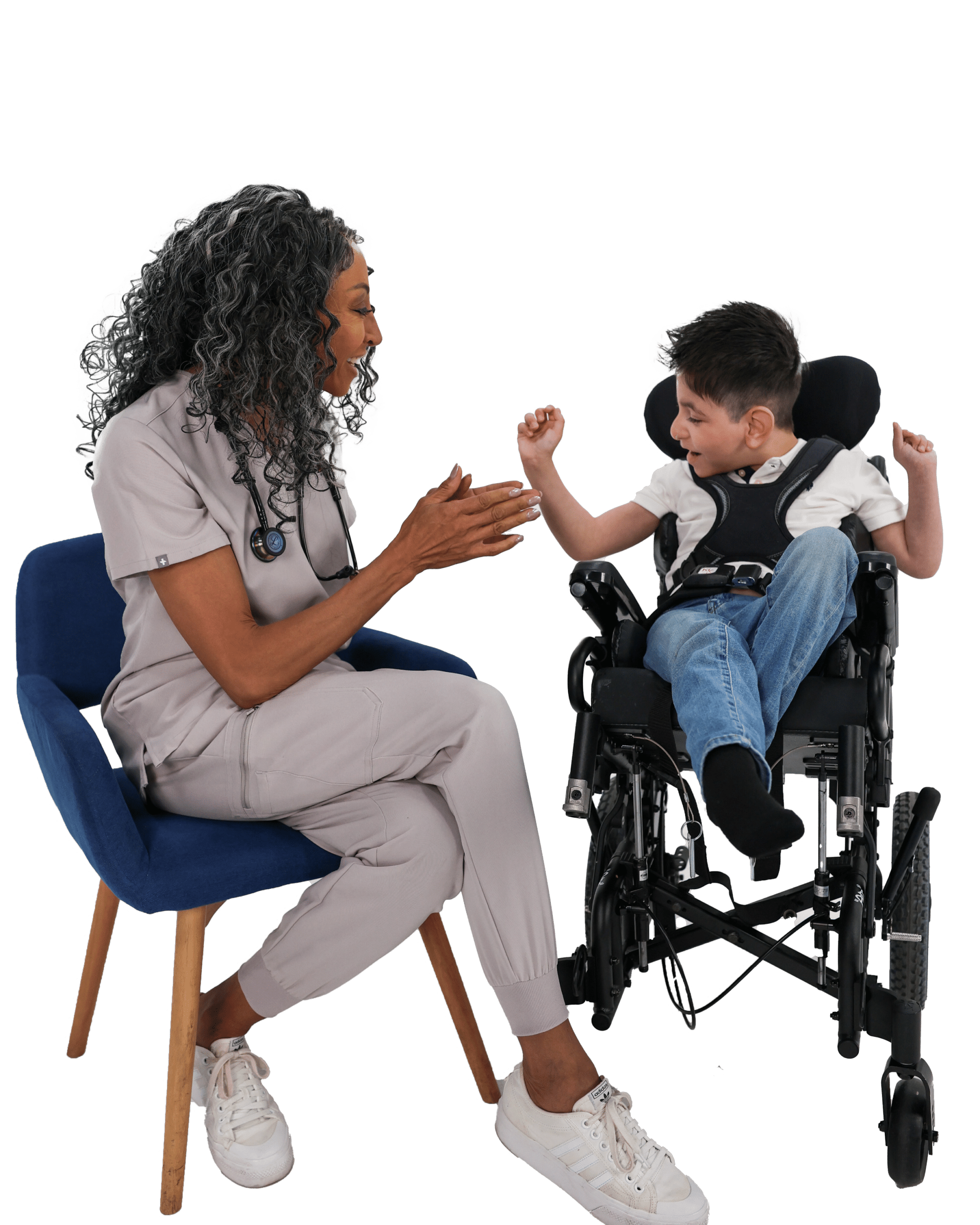 Long Term Pediatric Care with Team Select Home Care » Team Select Home Care Healthcare professional in scrubs sitting and smiling while talking with a smiling child in a wheelchair, sharing a moment of conversation.